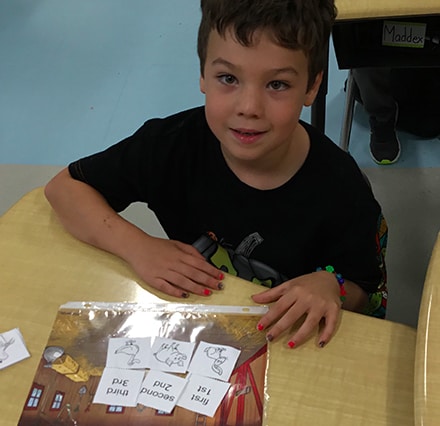 teacher helping kids